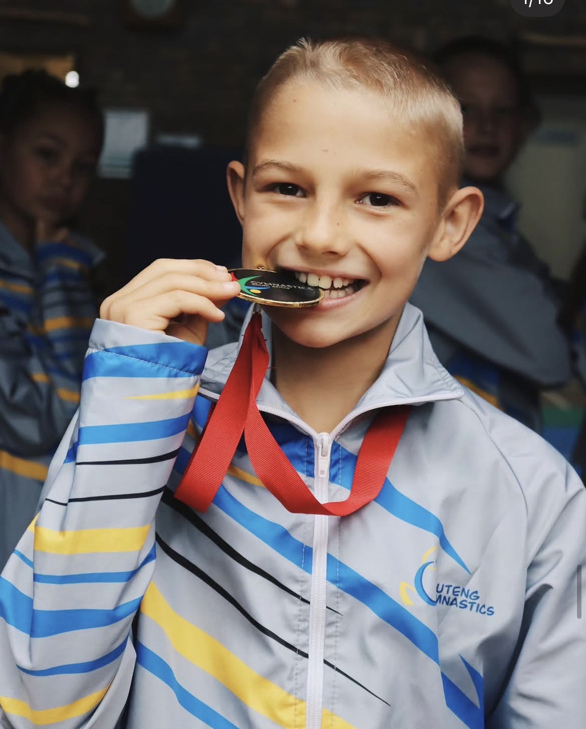 Athlete celebrating with his gold medal